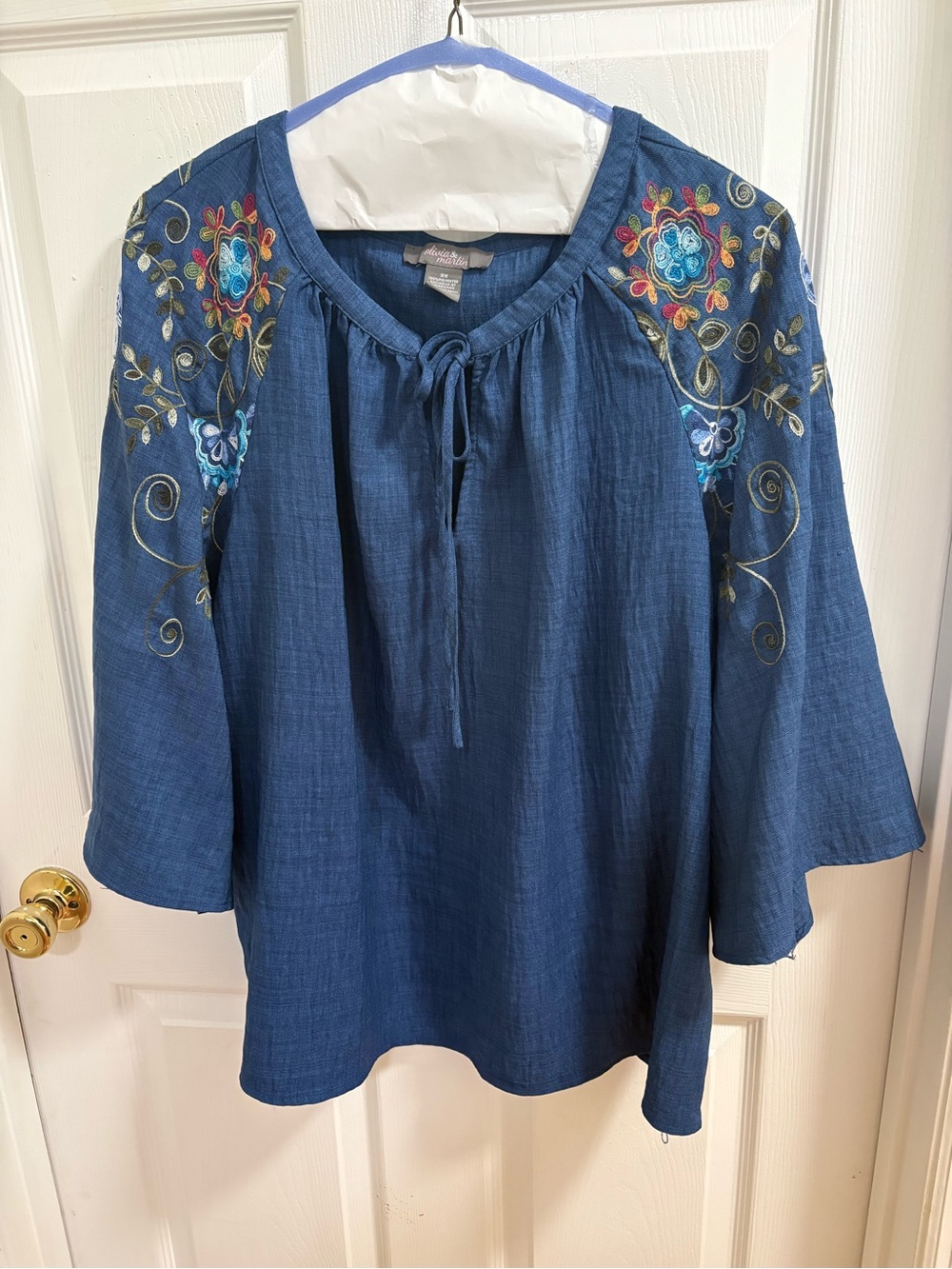 blue boho peasant tunic by Olivia & Martin, featuring colorful floral embroidery